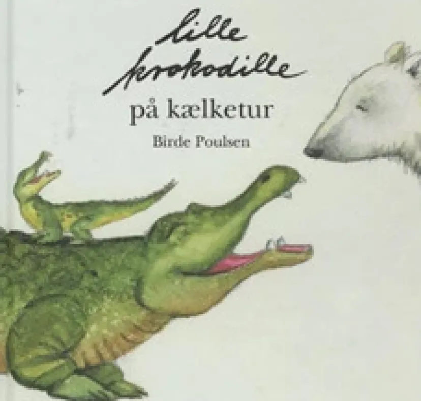 Lille krokodille på kælketur> New